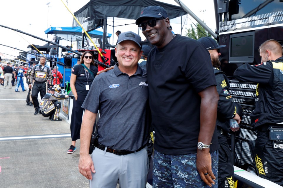 FILE - Bob Jenkins, owner of Front Row Motorsports and Co-Owner Michael Jordan, of 23XI Racing, pose before a NASCAR Cup Series auto race at Talladega Superspeedway, Oct. 6, 2024, in Talladega, Ala. (AP Photo/ Butch Dill, file)