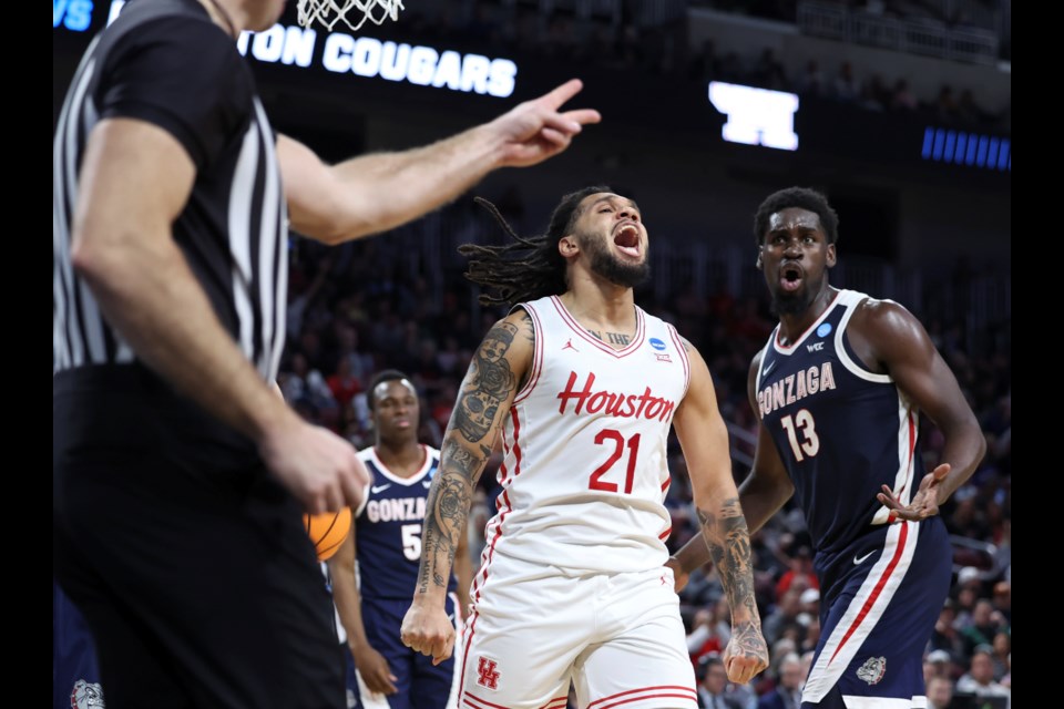 Houston guard Emanuel Sharp (21) reacts after a foul by Gonzaga forward Graham Ike (13) during the second half in the second round of the NCAA college basketball tournament, Saturday, March 22, 2025, in Wichita, Kan. (AP Photo/Travis Heying)