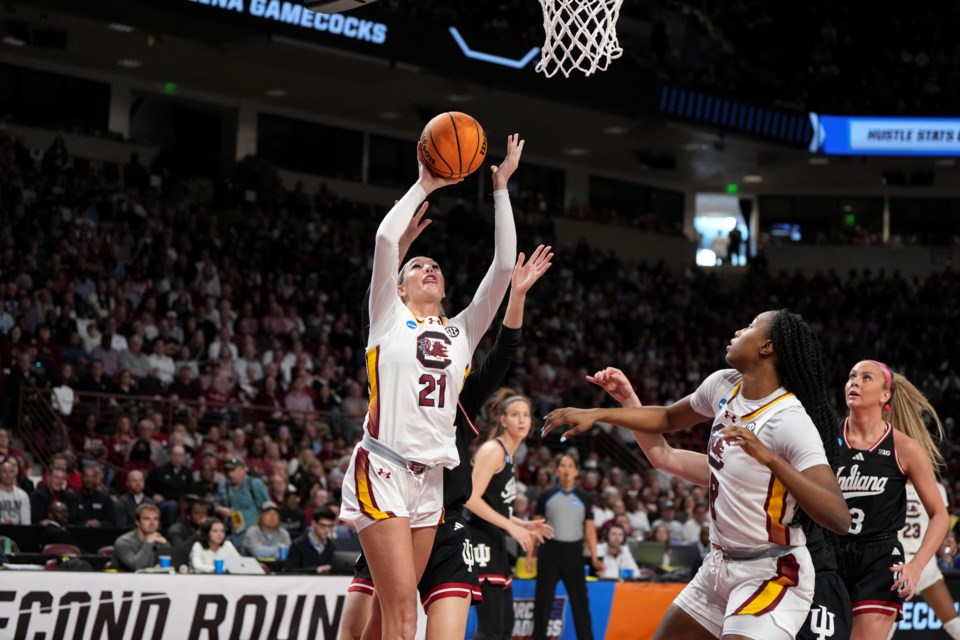 South Carolina forward Chloe Kitts (21) shoots against Indiana defenders during the first half in the second round of the NCAA college basketball tournament, Sunday, March 23, 2025, in Columbia, S.C. (AP Photo/David Yeazell)