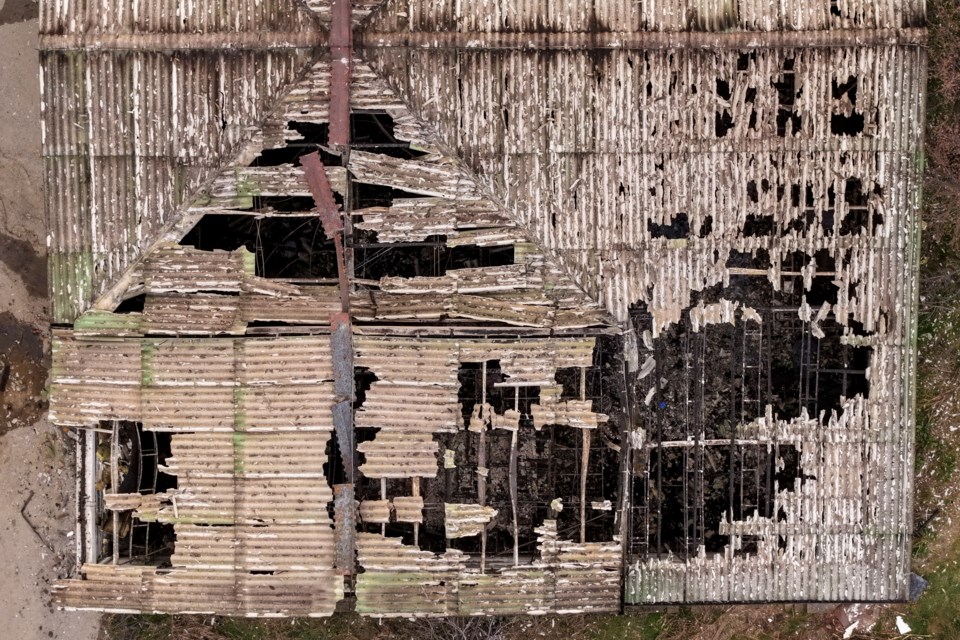 An aerial photograph shows the damaged roof of a nightclub in the town of Kocani, North Macedonia, Sunday, March 16, 2025, following a massive fire in the nightclub early Sunday. (AP Photo/Armin Durgut)