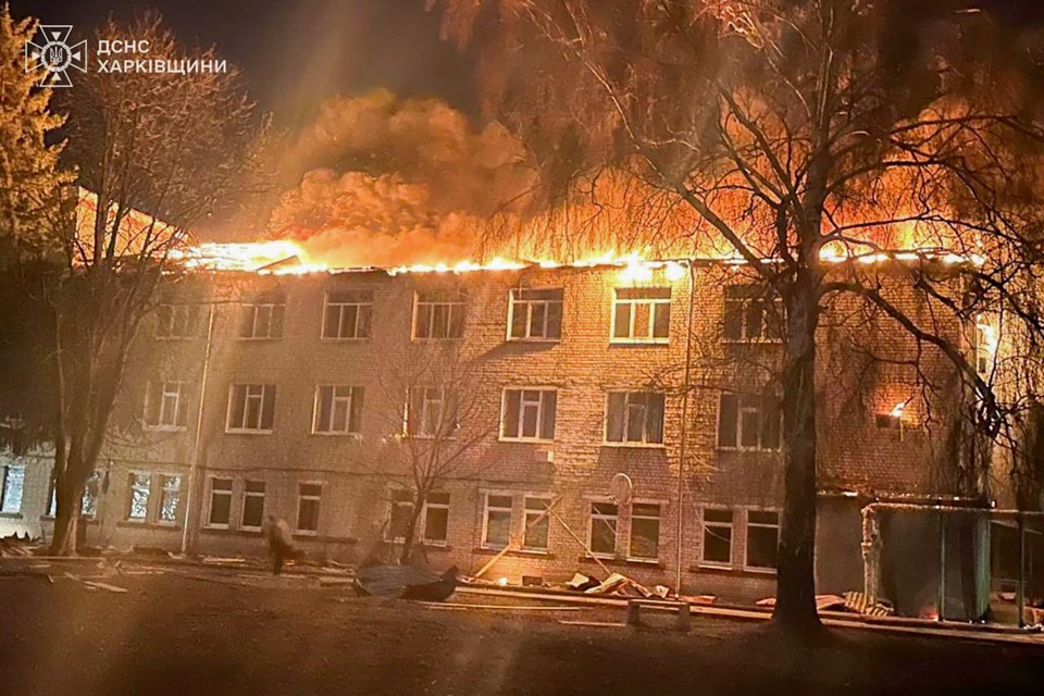 In this photo provided by the Ukrainian Emergency Service, firefighters put out the fire at a civilian hospital following a Russian drone attack in Zolochiv, Kharkiv region, Ukraine, Friday, March 14, 2025. (Ukrainian Emergency Service via AP)