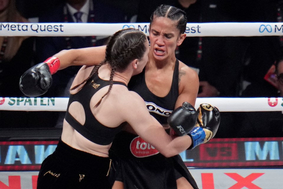 FILE - Amanda Serrano, right, and Katie Taylor fight during their undisputed super lightweight title bout, Friday, Nov. 15, 2024, in Arlington, Texas. (AP Photo/Julio Cortez, File)