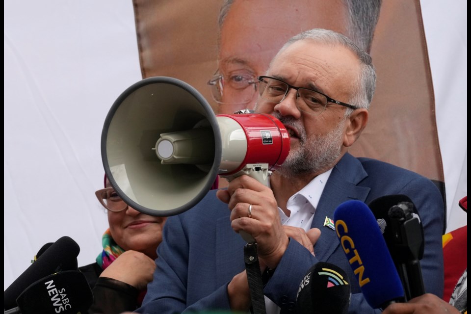 Expelled South Africa Ambassador Ebrahim Rasool speaks to supporters following his arriving, at Cape Town International Airport in Cape Town, South Africa, Sunday, March 23, 2025. (AP Photo/Nardus Engelbrecht)