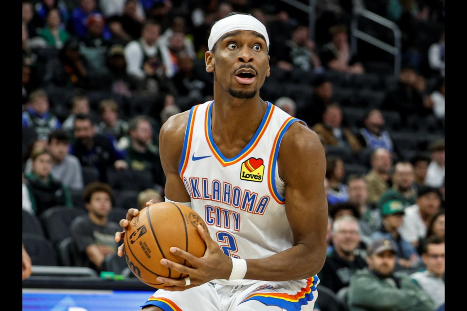 Oklahoma City Thunder's Shai Gilgeous-Alexander looks to pass the ball against the Milwaukee Bucks during the second half of an NBA basketball game Sunday, March 16, 2025, in Milwaukee. (AP Photo/Jeffrey Phelps)