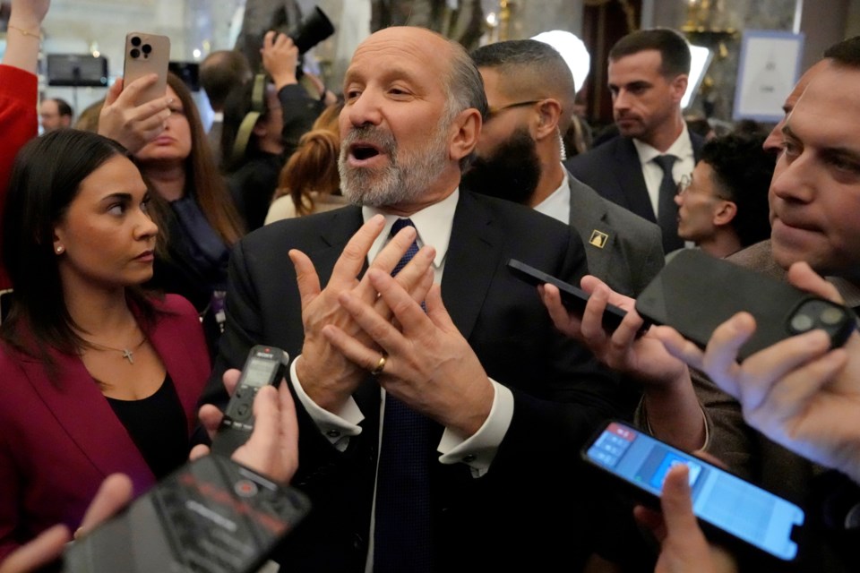 Secretary of Commerce Howard Lutnick speaks with reporters after President Donald Trump addressed a joint session of Congress at the Capitol in Washington, Tuesday, March 4, 2025. (AP Photo/Ben Curtis)