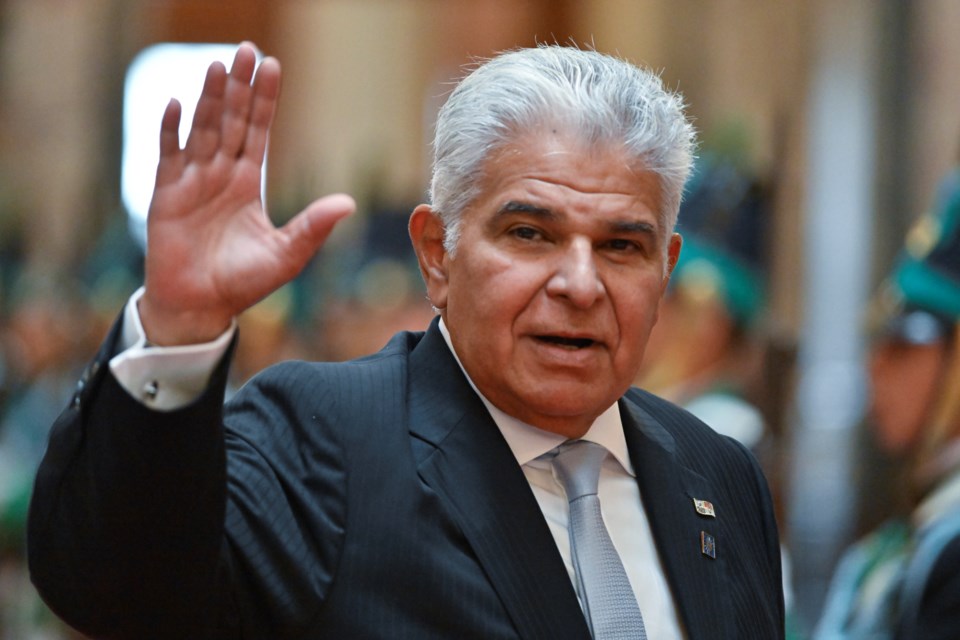 Panama's President Jose Mulino waves as he arrives to Congress to attend President-elect Yamandu Orsi's swearing-in ceremony, on Inauguration Day in Montevideo, Uruguay, Saturday, March 1, 2025. (AP Photo/Santiago Mazzarovich)