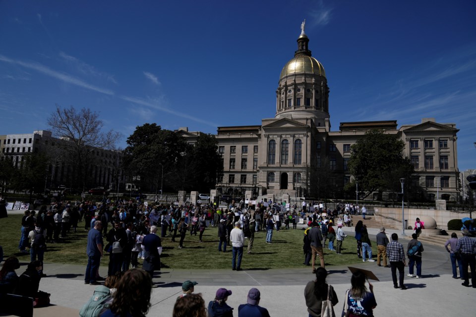 People attend a Stand up for Science rally in Liberty Plaza near the Georgia State capitol on Friday, March 7, 2025, in Atlanta. (AP Photo/Brynn Anderson)