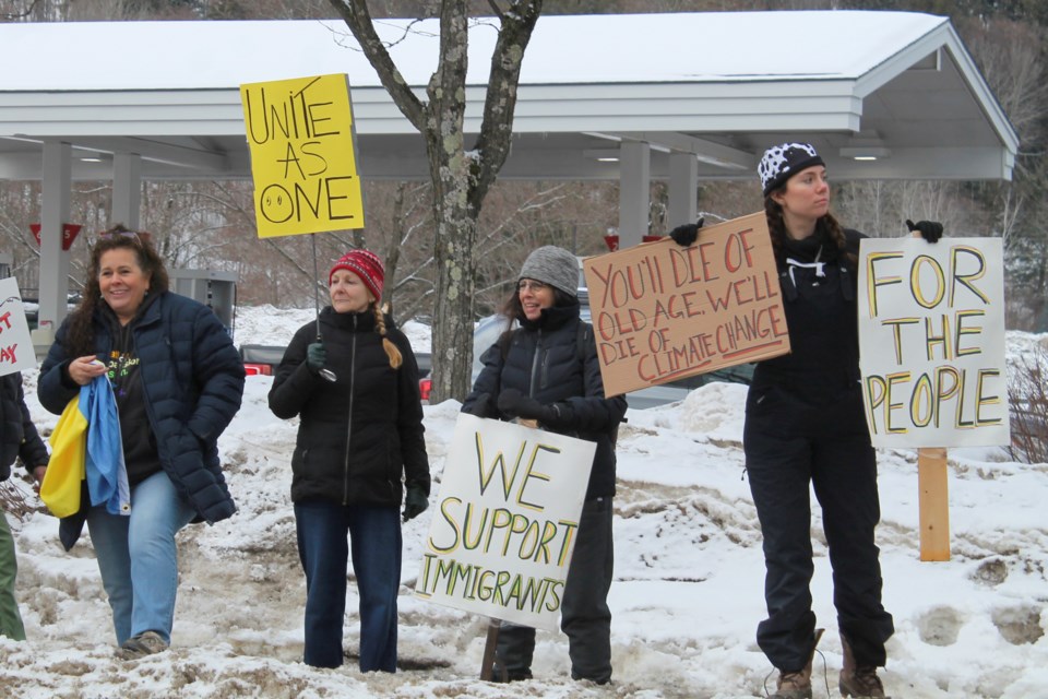 Protesters line Main Street in Waitsfield, Vt., to protest Vice President JD Vance's visit on Saturday, March 1, 2025. (Erin Minichiello via AP).