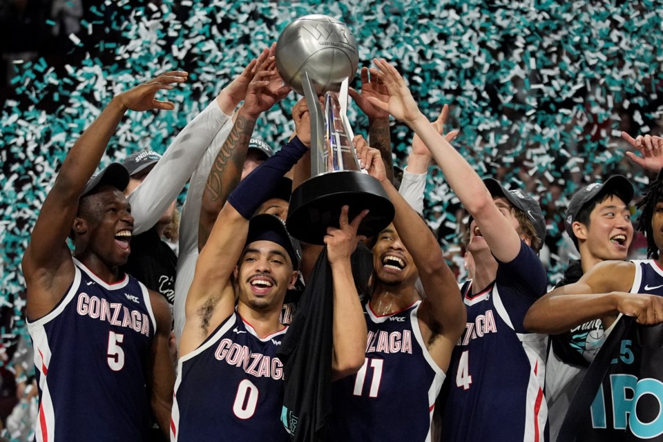 Gonzaga players celebrate after defeating Saint Mary's in an NCAA college basketball championship game in the West Coast Conference men's tournament Tuesday, March 11, 2025, in Las Vegas. (AP Photo/John Locher)