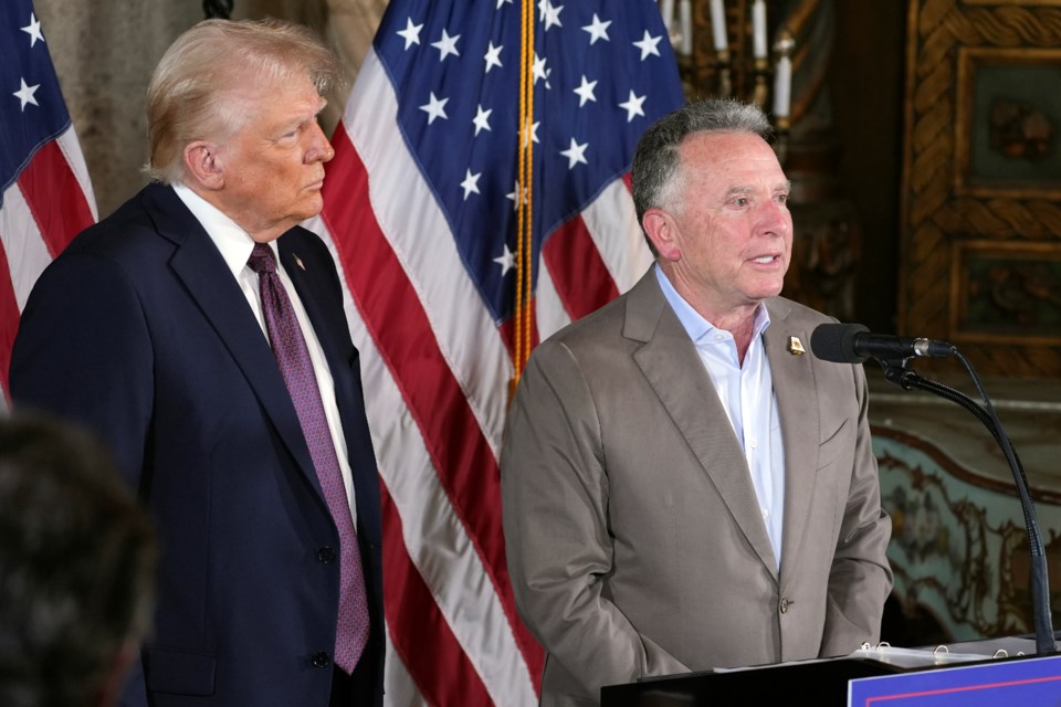 FILE - President-elect Donald Trump listens as Steve Witkoff speaks during a news conference at Mar-a-Lago, Jan. 7, 2025, in Palm Beach, Fla. (AP Photo/Evan Vucci, File)