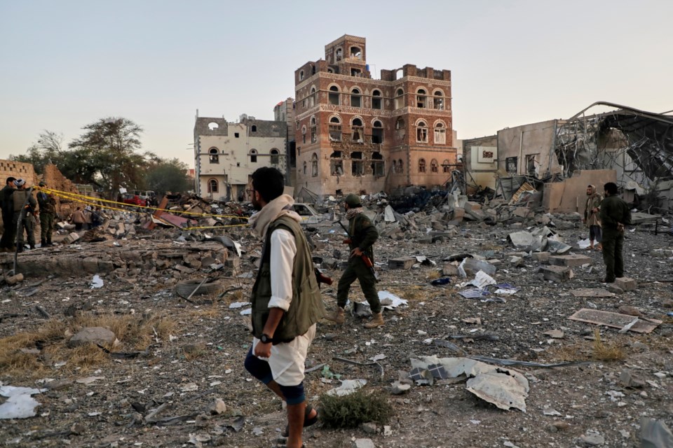 Locals inspect the site reportedly struck by U.S. airstrikes overnight in Sanaa, Yemen, Thursday, March 20, 2025. (AP Photo)