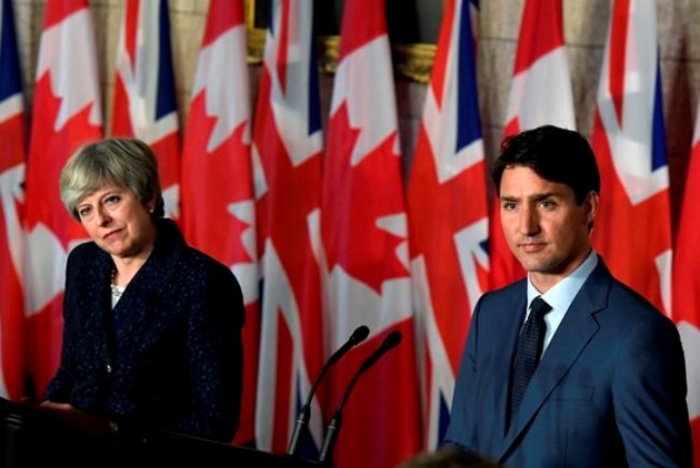 May hopes to boost Bombardier on trade mission to Canada