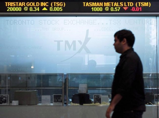 Markets Right Now: Stocks climb on buyouts, profit reports