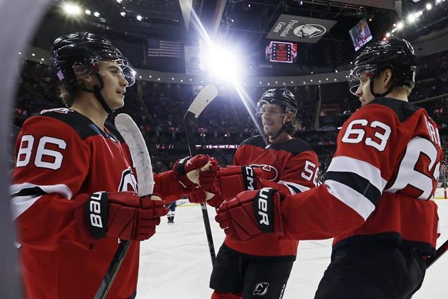 Hughes has first NHL hat trick, Devils beat Capitals 5-1 - ABC7 New York
