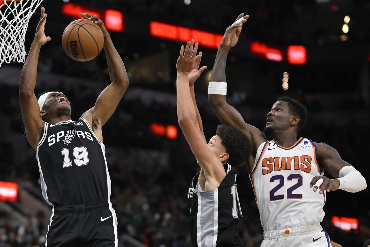 Tim Duncan of the San Antonio Spurs grabs the rebound against