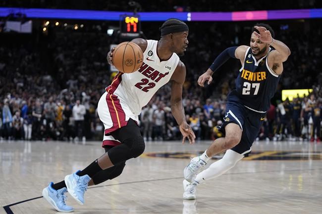 Miami Heat forward Jimmy Butler (22) dribbles the ball against Miami Heat  forward Jimmy Butler (22) during the third quarter in game one of the 2023  NBA Finals at Ball Arena.