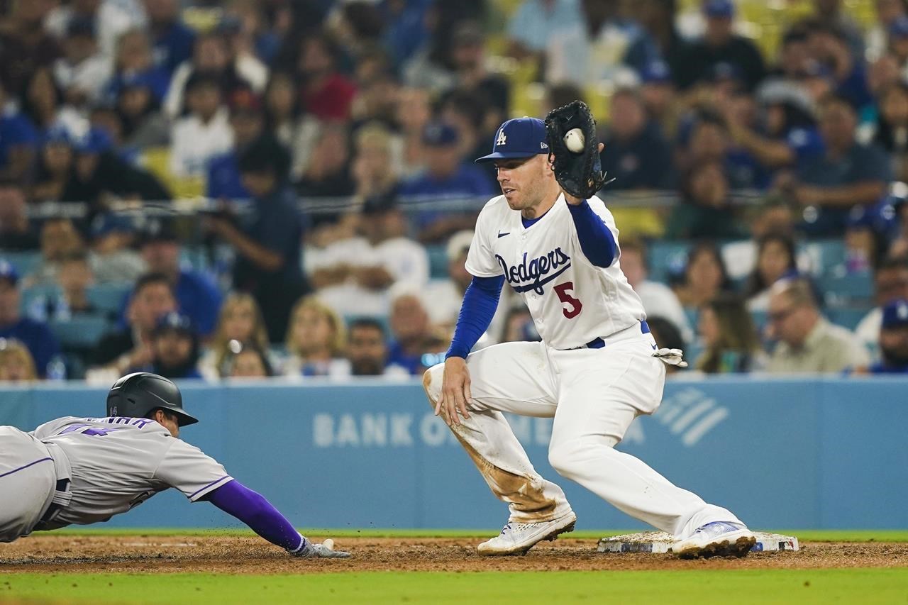 Los Angeles Dodgers' Clayton Kershaw, second from right, poses