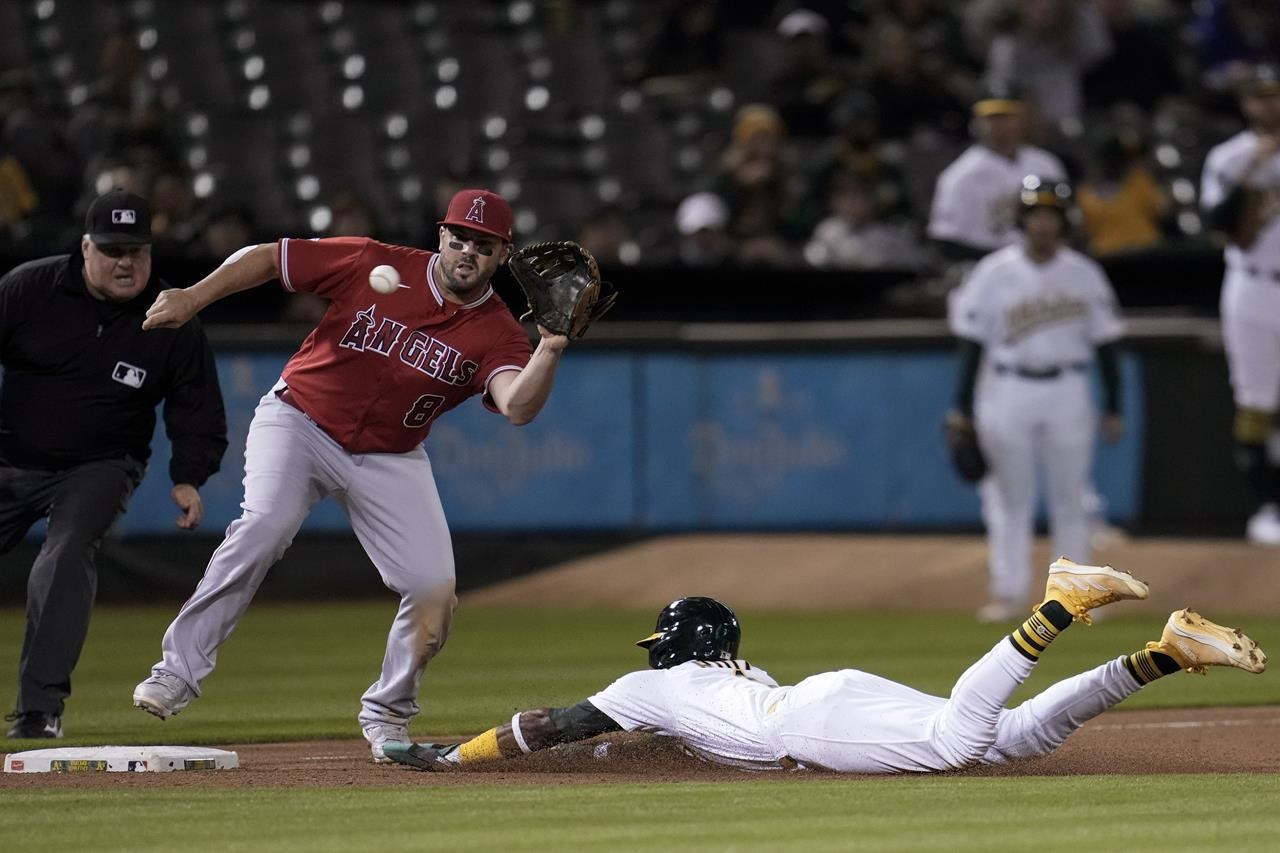 Los Angeles Angels' Gerardo Reyes throws during a spring training