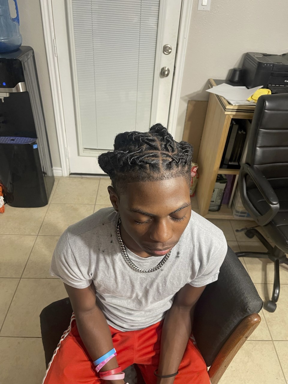 A Black student was suspended for his hairstyle. The school says it ...