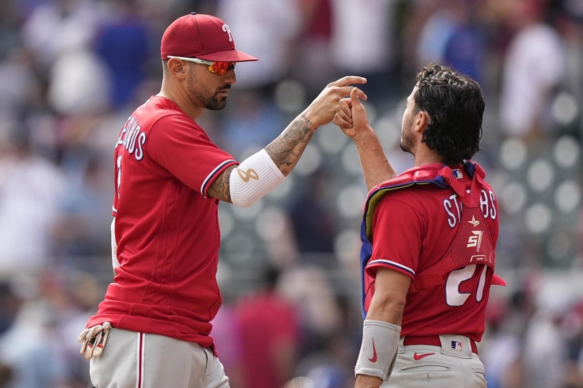 Rallying Reds do it again, defeat Braves 11-10 in wild game at