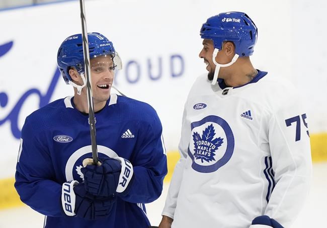 Toronto Maple Leafs teammates Max Domi, left, and Ryan Reaves laugh during  NHL hockey training camp in Toronto, Thursday, Sept. 21, 2023. (Nathan  Denette/The Canadian Press via AP Stock Photo - Alamy