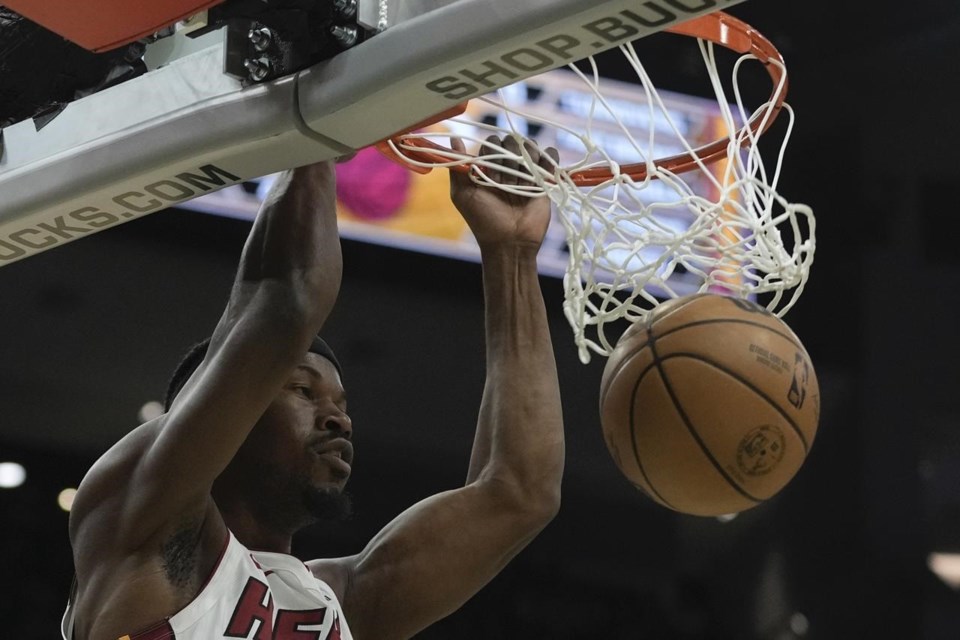 Antetokounmpo, Lillard help Bucks build big lead, hold off Heat in playoff  rematch