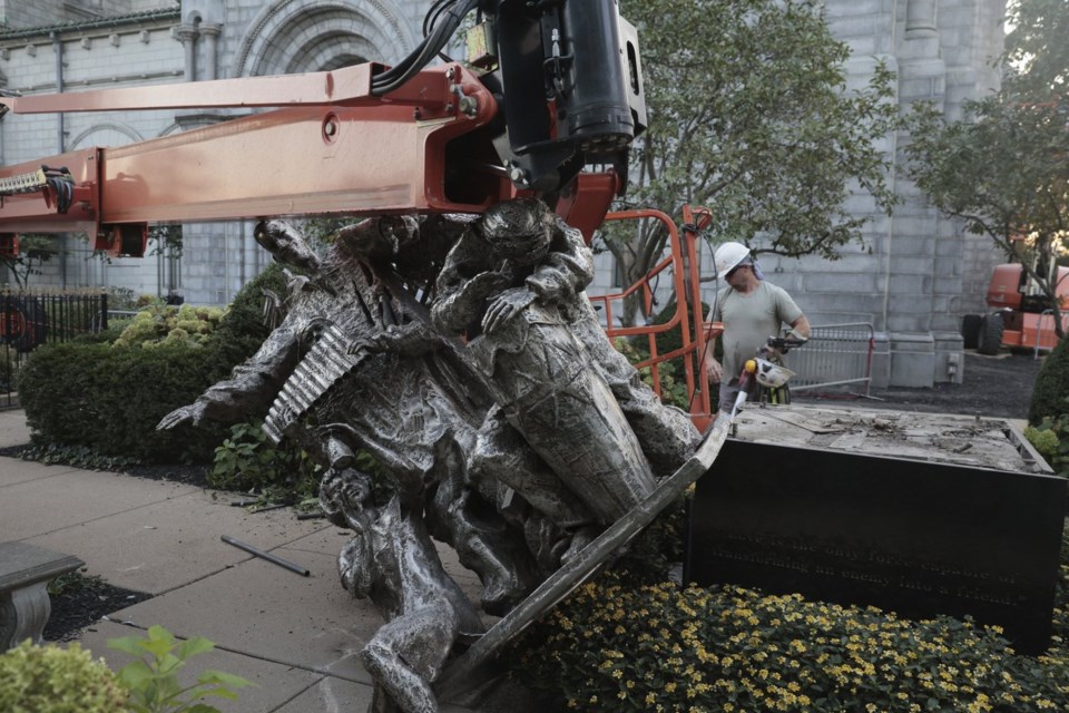 A vandal badly damaged a statue outside a St. Louis cathedral, police say