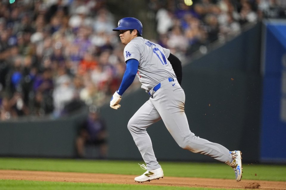 Ohtani has 2 hits to close on batting leader Arraez in Triple Crown bid