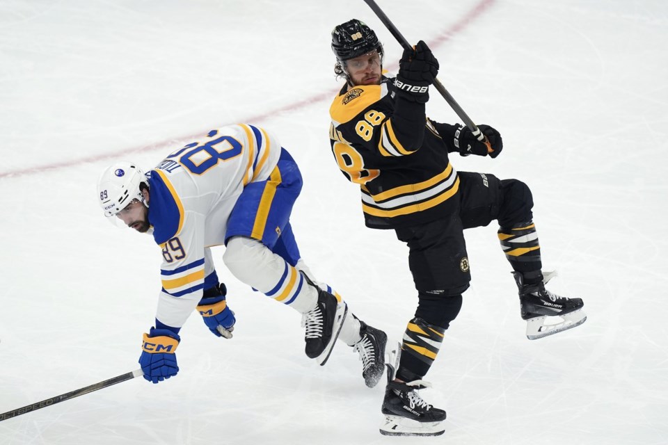 Bruins leading scored David Pastrnak leaves game with upper-body injury