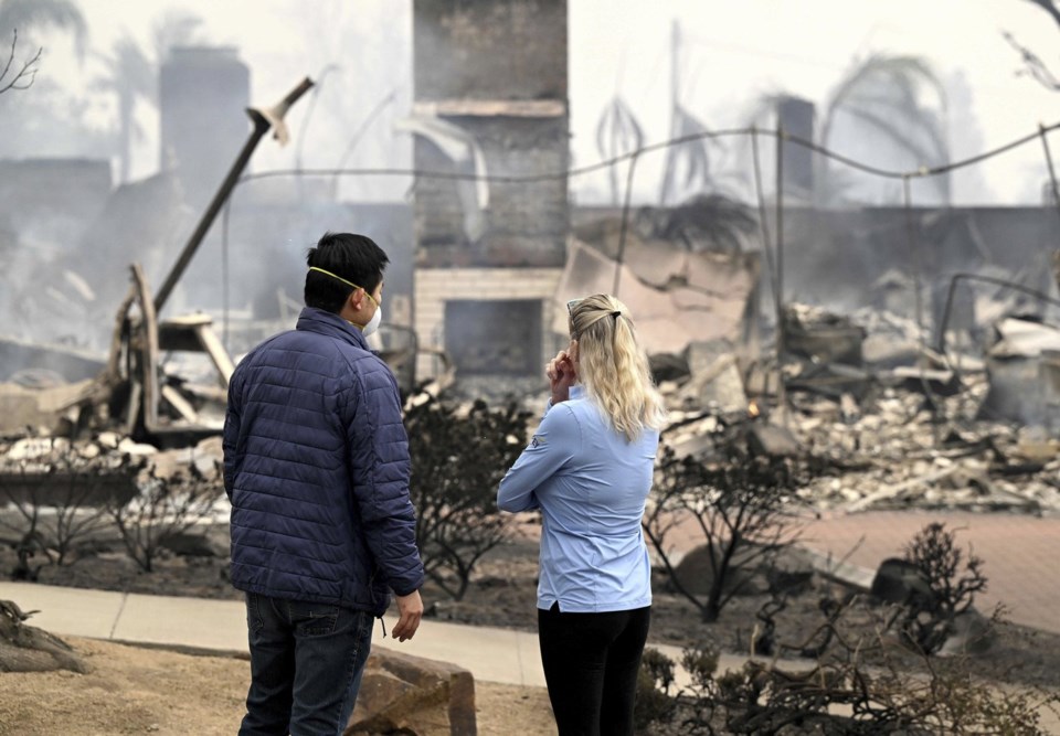 Wildfires latest: Tens of thousands ordered to evacuate as fires tear through Los Angeles area