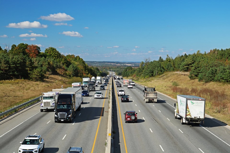 Traffic streams along Highway 400 near Line 11 in Bradford in September 2024.