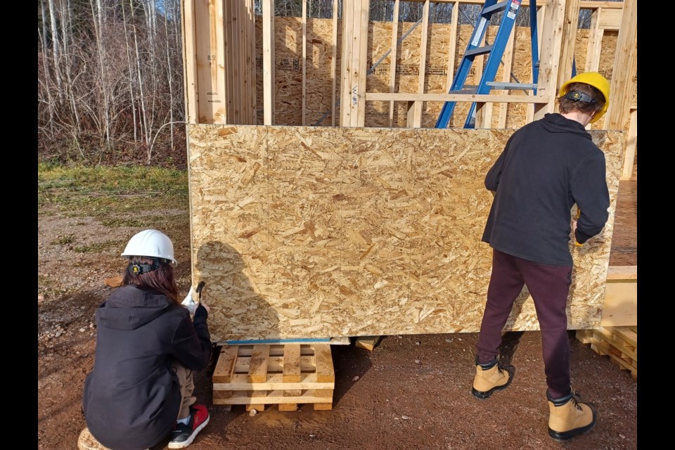 Nipigon-Red Rock High School students work on a house Oct. 5, 2024, on the school campus.