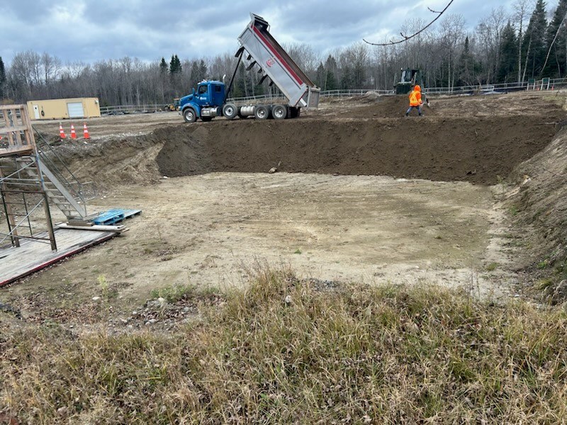 Excavated soil is returned to a site in the Lake Superior National Marine Conservation Area in early November 2024.