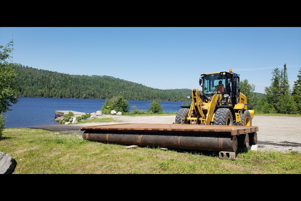 Putting in the new dock. 
photo by Marya Kalen