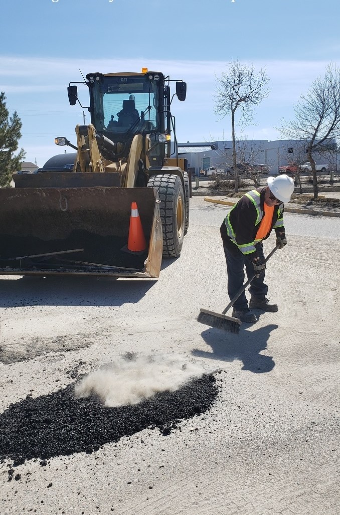 Gary A. filling in potholes in Manitouwadge Photo by Marya Kalen