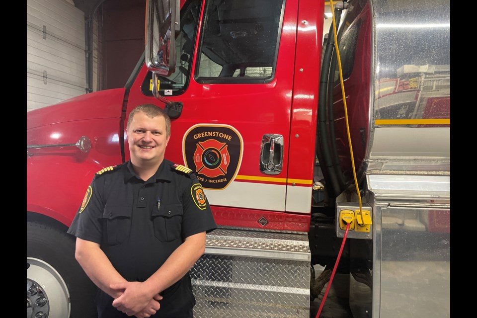 Director of Fire Services Adam Lopatka poses next to one of the fire trucks at Greenstone Fire Station #2 on December 11, 2023.