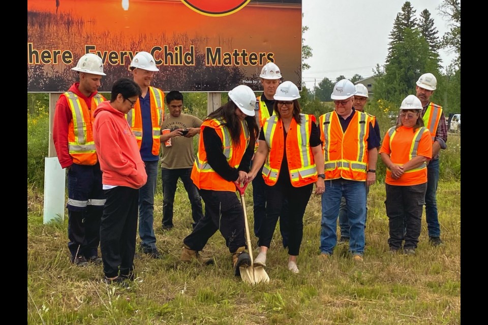 Chief Sheri Taylor stands alongside other members of Ginoogaming First Nation to commemorate the official groundbreaking of their road and drainage rehabilitation project on July 29, 2024.