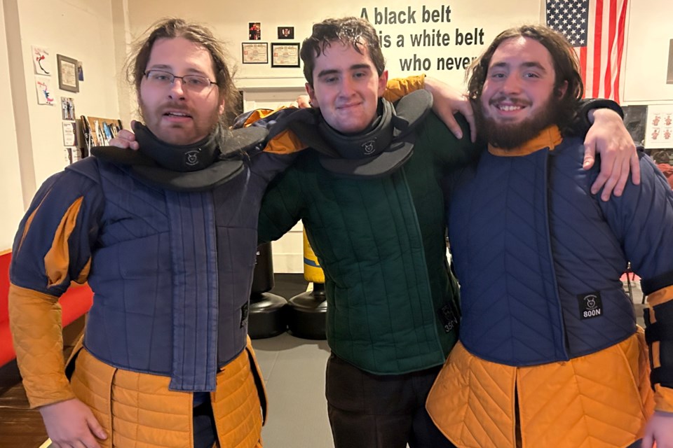 Instructor Nathaniel Skinner (L) and students Alexander Laird (C)  and Jacob Jackson (R)