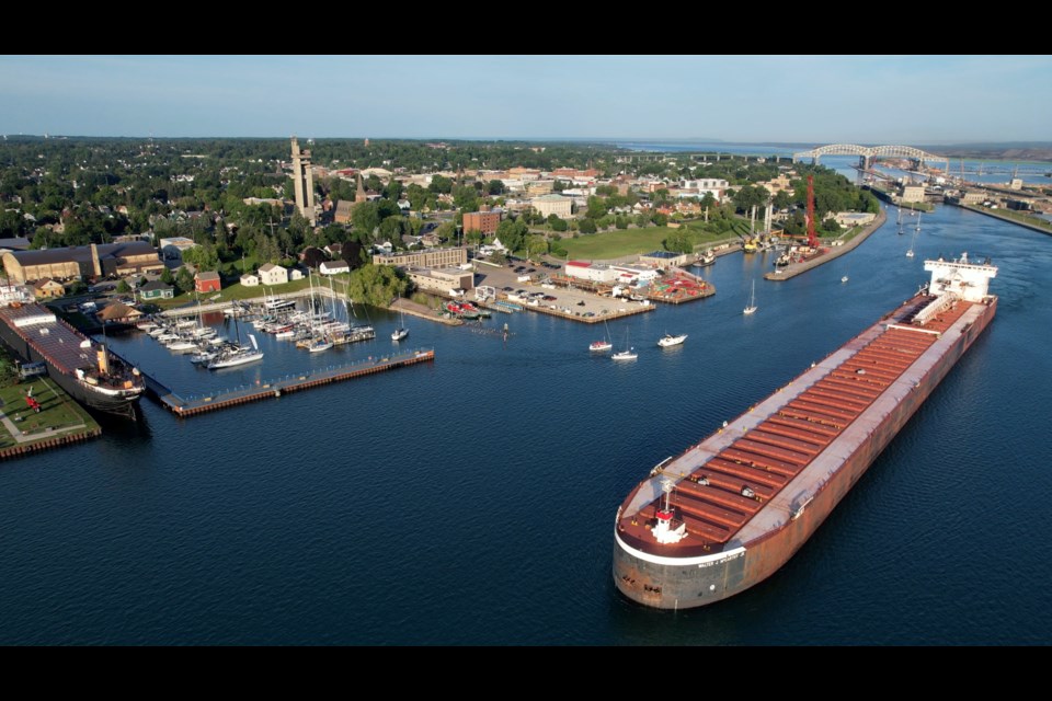 The Walter J. McCarthy Jr. passes George Kemp Marina as the sailboats leave