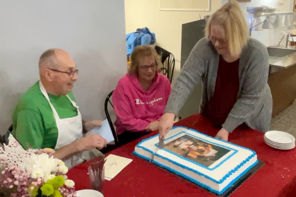 Gary Rogers and his wife, Gayle, celebrate his last day as head cook at Frank's Place.