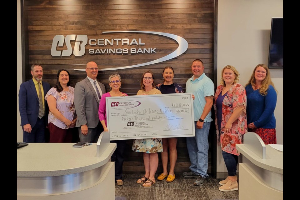 CSB Assistant Vice President Justin McLean, CSB Marketing Director Andrea Master, CSB CEO President Mark Savoie, Soo Locks Children's Museum Board President Raquel Fernandez-Earns, Alexandra VanDoren, Laura Fisher, Dustin McClelland, Erin Heyboer, and Cathryn Meninga at Central Savings Bank on Thursday, Aug. 10, 2022