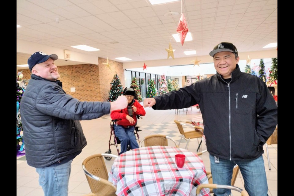 City Commissioner Steve Habusta supports Roll the Veg this Christmas with owner Anthony Lagrosa 