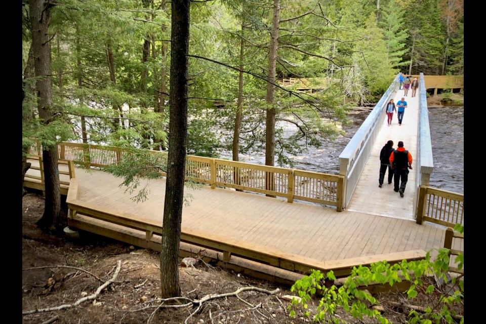 The new pedestrian bridge over the Tahquamenon River connects the mainland to an island in the rapids; it officially opened to visitors over the 2022 Memorial Day holiday weekend.