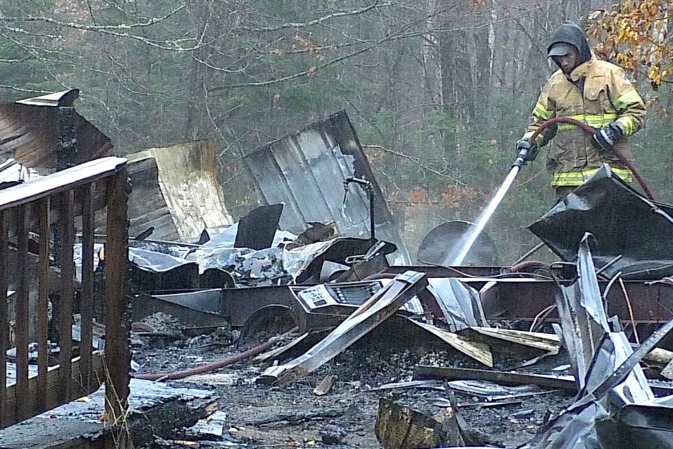 Firefighters returned to the scene of a fire that destroyed a cabin on Sunday night.