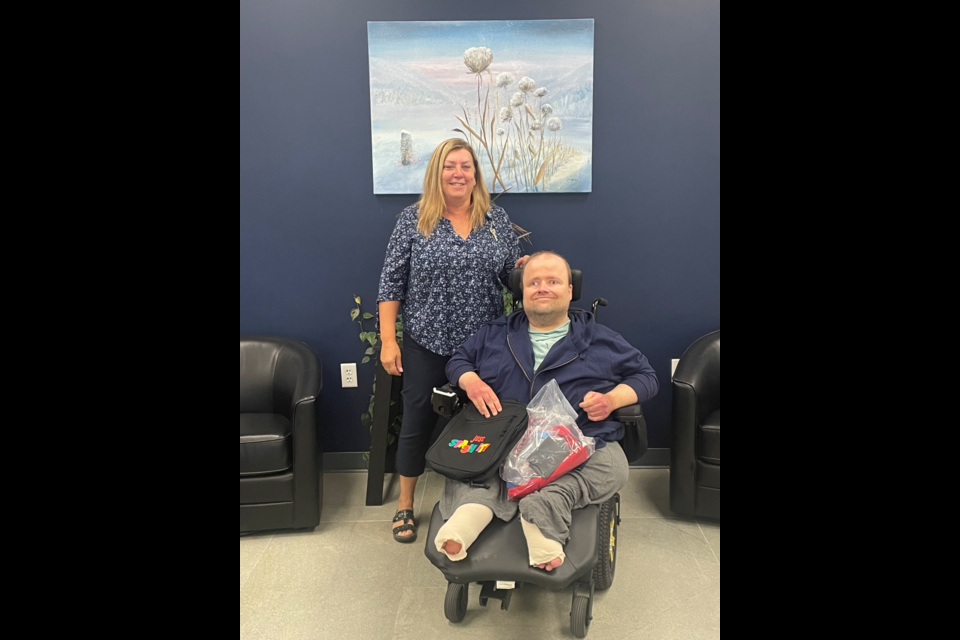 CEO Connie Toensing presents Gregor Krause with his award at Chippewa County Credit Union 
