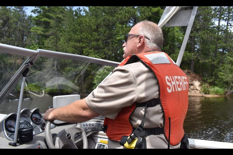 Newly appointed undersheriff, Lawrence Hough, is seen here patrolling the waterways in the area.