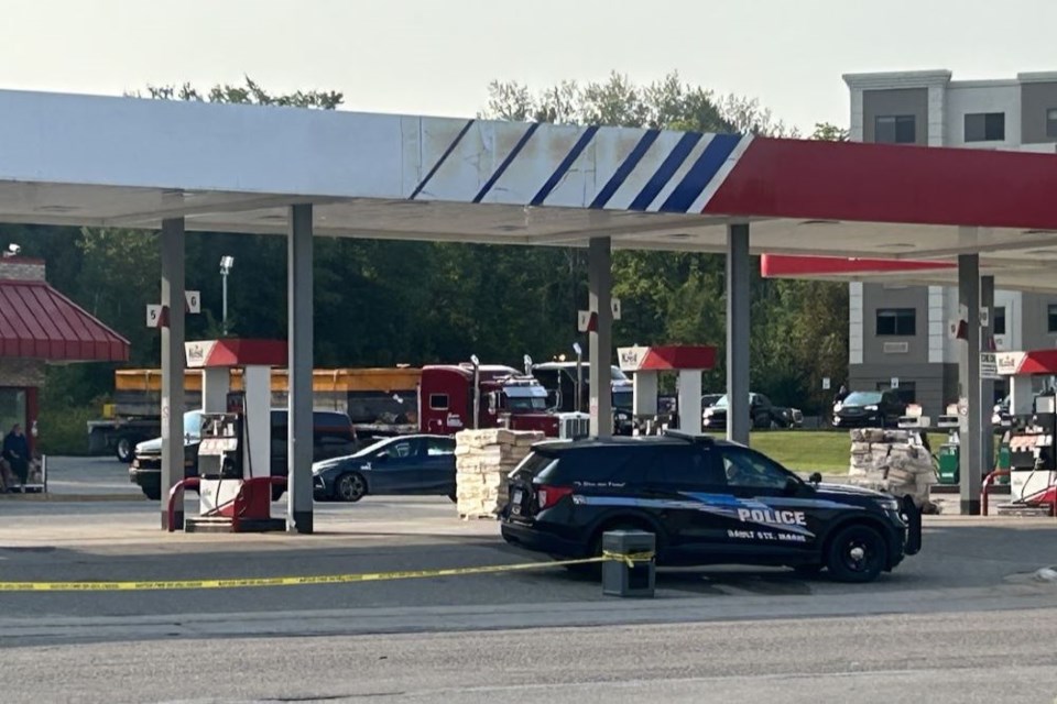 Police tape blocks the entrance to the Kris gas station on Ashmun Street on Wednesday morning. 