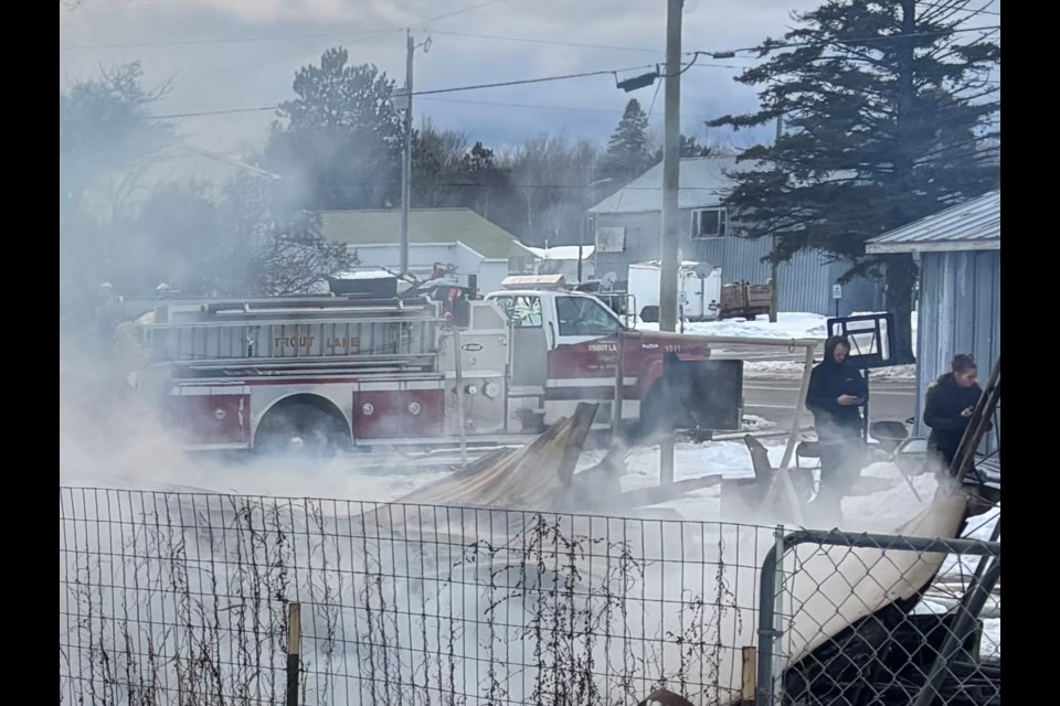 Emergency crews respond to a report of a house fully engulfed in flames on W. Main Street near M-123 Highway in Trout Lake Township on December 17, 2024