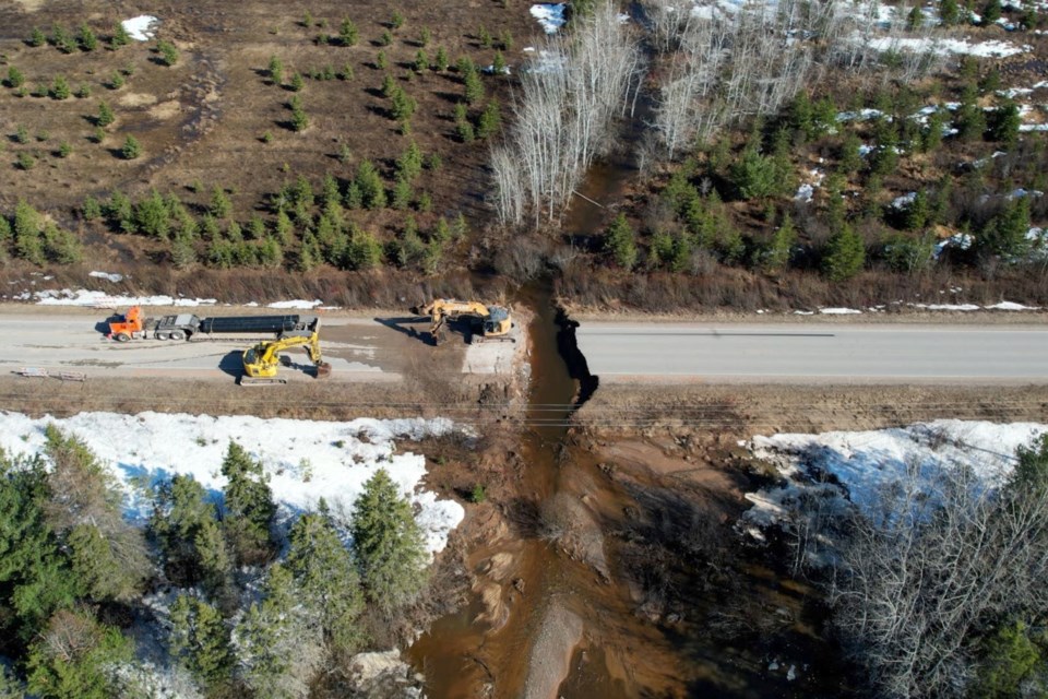 A portion of 15 Mile Road was washed out on April 14 and remained closed the following day as crews worked to get the road reopened.