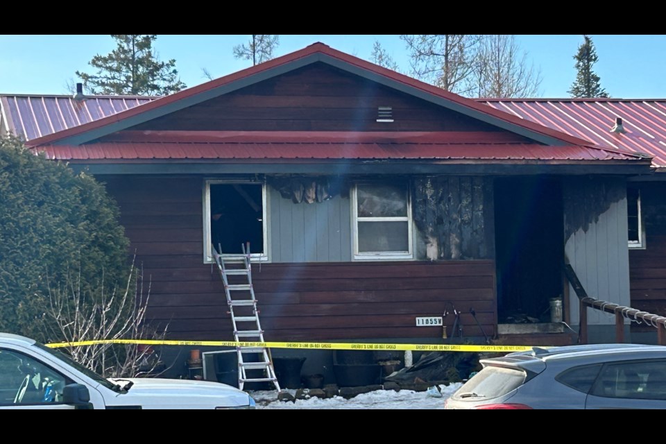 A ladder stands at the bedroom window where inside the disabled elderly woman died.